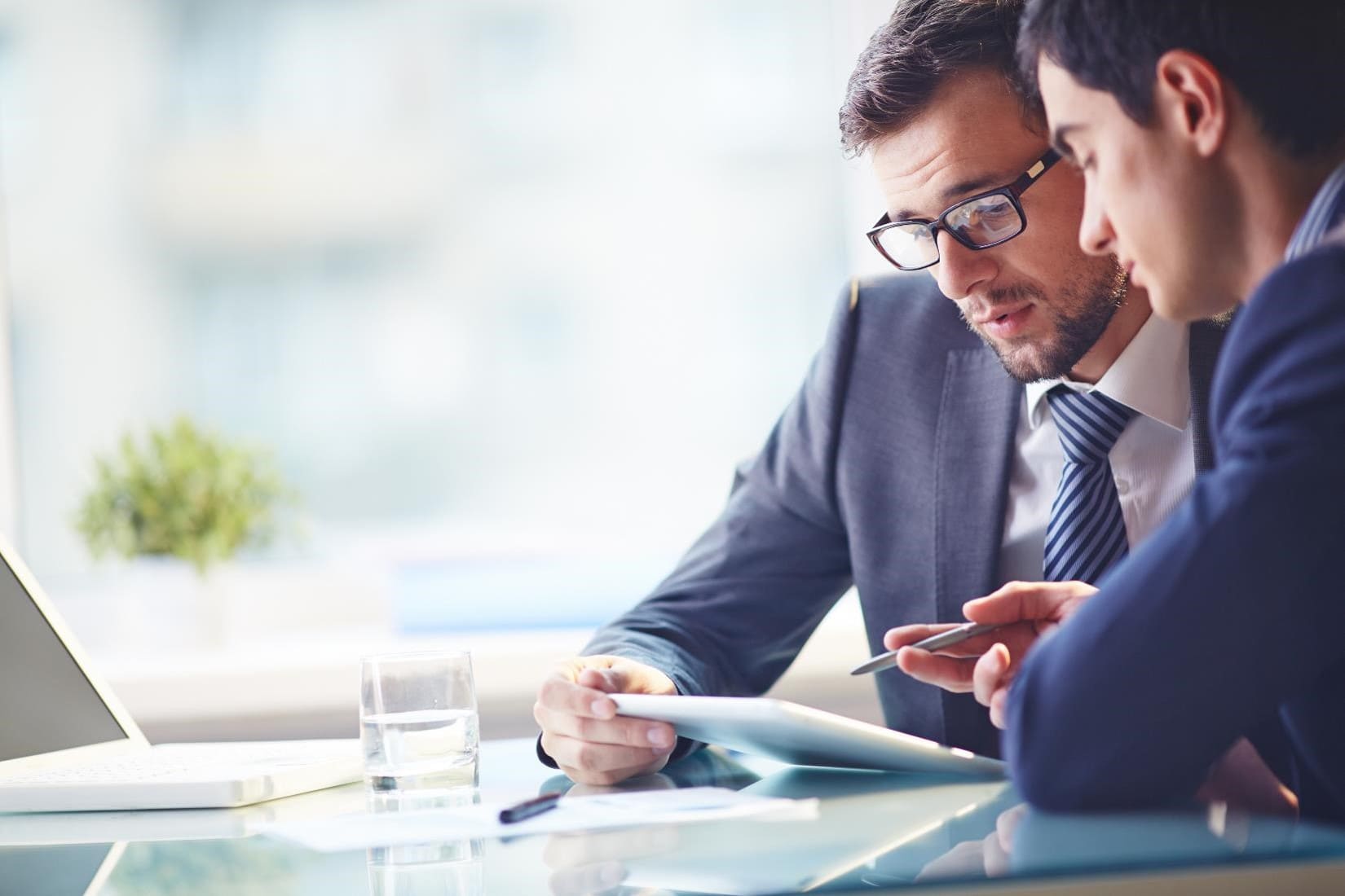 Attorneys reviewing a commercial contract with a client