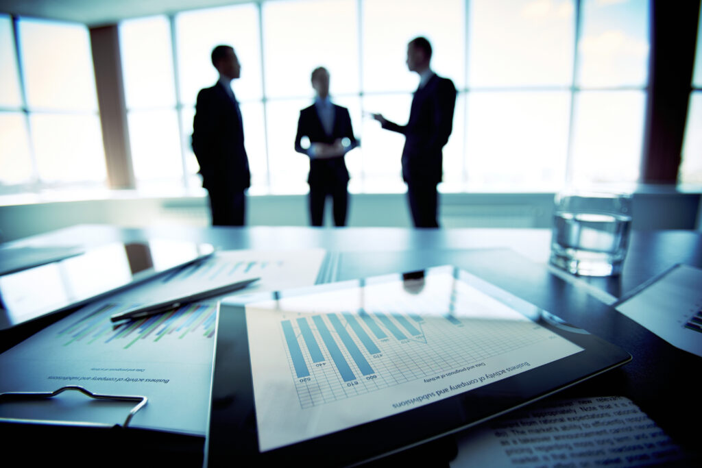 Business leaders meeting in a conference room with outside general counsel